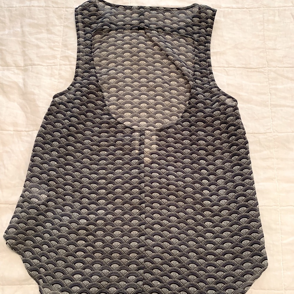 Sheer, cut out back, sleeveless blouse